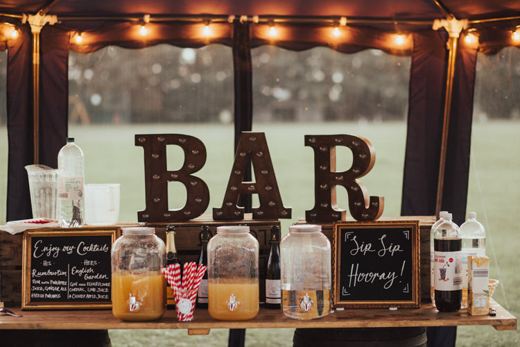 Bar Vintage Rustic Light Up Circus Lights Black Board Gold Frame Kilner Drinks Dispensers Fairy Lights Stylish Budget Friendly Village Hall Wedding http://natalyjphotography.com/