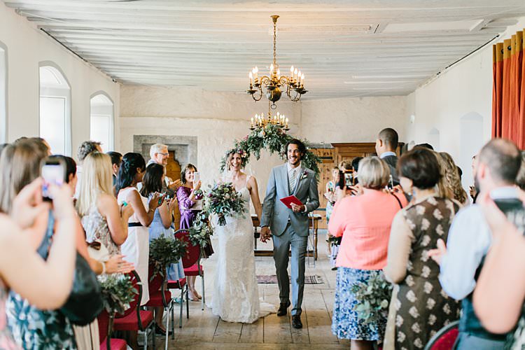 Destination Ceremony Bride Groom Aisle Wild Natural Bouquet Chandeliers Floral Arch | Romantic Castle Switzerland Wedding http://kbalzerphotography.com/
