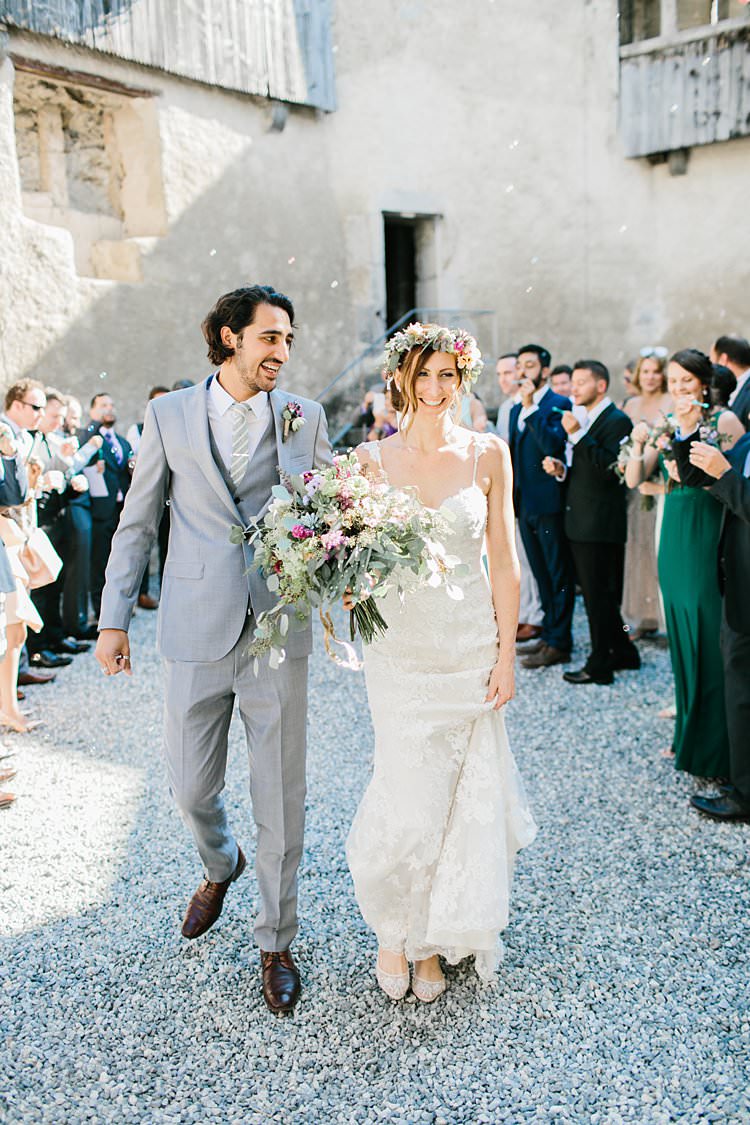 Destination Summer Mountains Confetti Relaxed Sweetheart Dress Grey Suit Bride Groom | Romantic Castle Switzerland Wedding http://kbalzerphotography.com/