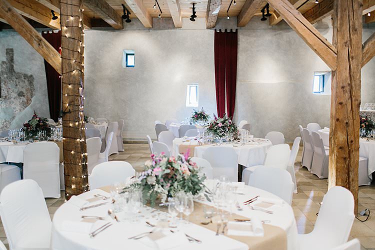 Destination Wooden Beams Fairy Lights White Brown Tablescapes Floral Centrepieces Rustic | Romantic Castle Switzerland Wedding http://kbalzerphotography.com/