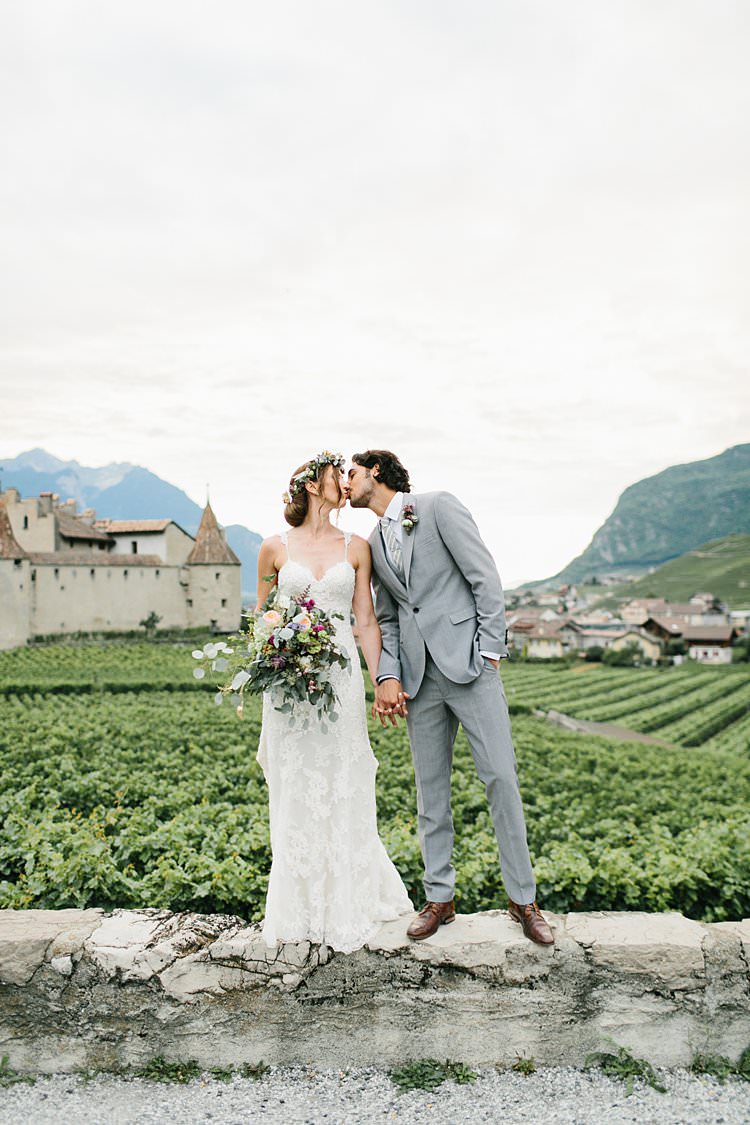 Beautiful Destination Mountains Summer Vineyards Fields Bride Groom Kiss | Romantic Castle Switzerland Wedding http://kbalzerphotography.com/