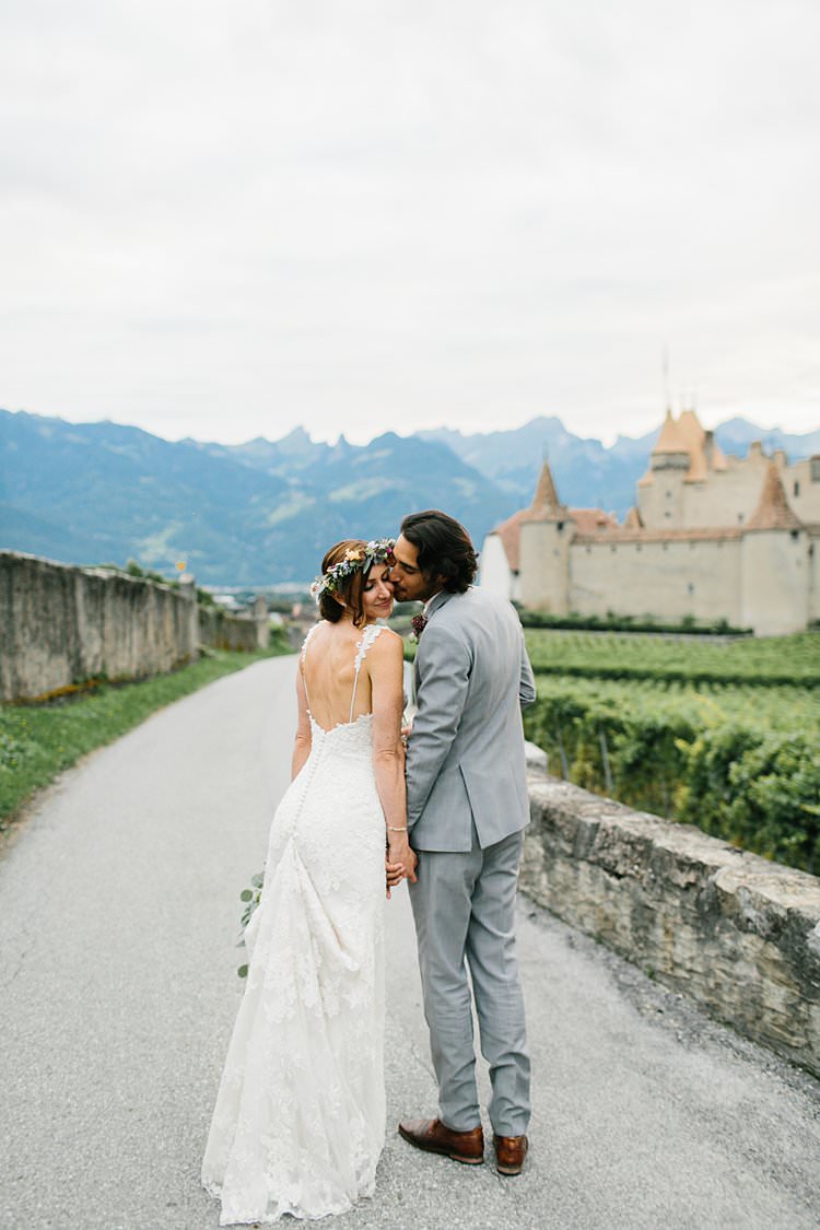 Beautiful Destination Mountains Summer Vineyards Fields Bride Groom Kiss | Romantic Castle Switzerland Wedding http://kbalzerphotography.com/