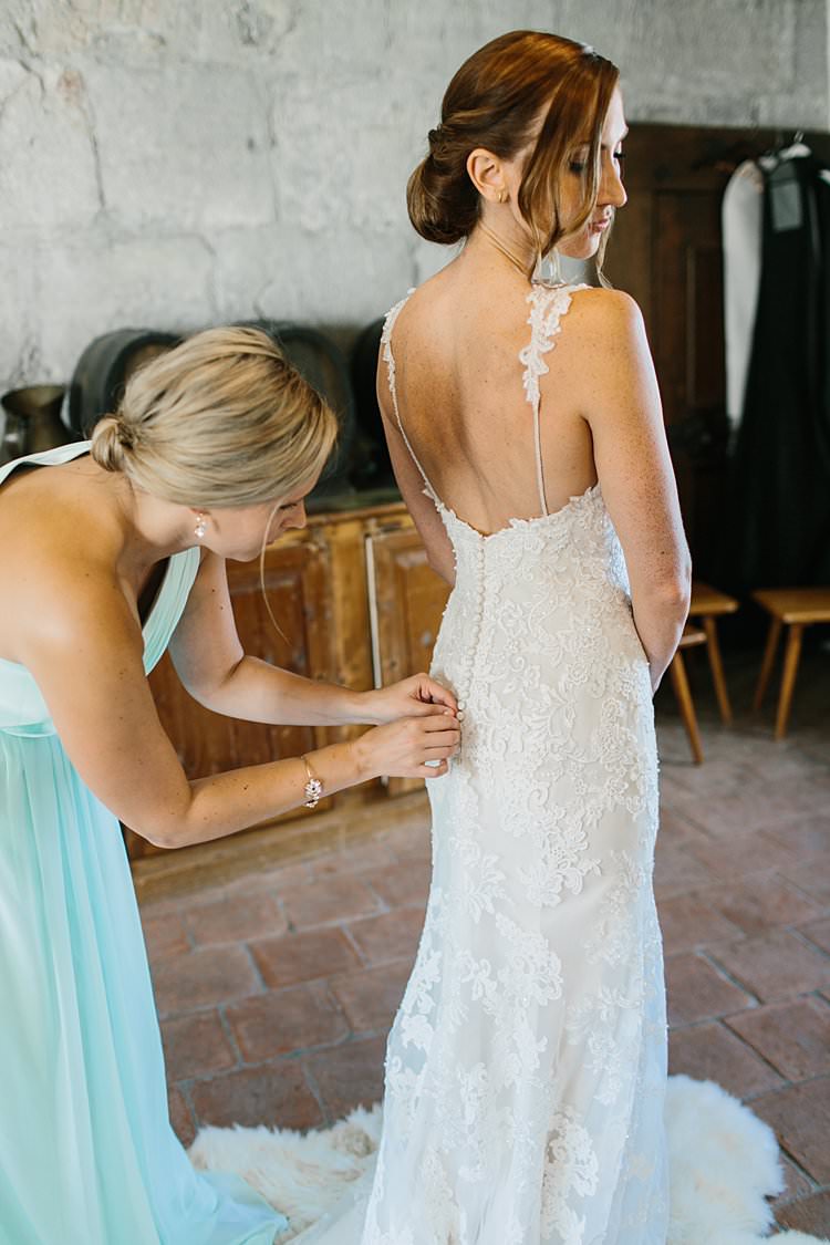Bridal Prep Lace Spaghetti Strap Sweetheart Bride Updo Buttons Train | Romantic Castle Switzerland Wedding http://kbalzerphotography.com/