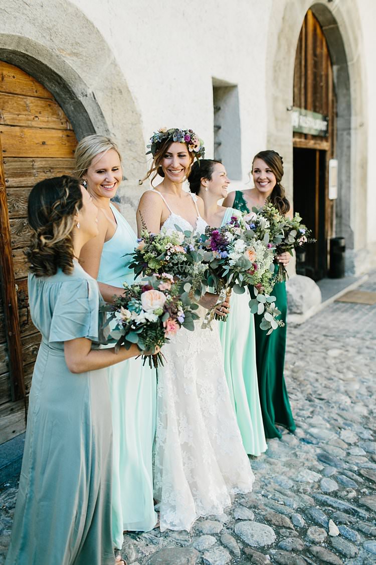 Destination Bride Bridesmaids Bouquets Green Gowns Smile Bridal Party Photo | Romantic Castle Switzerland Wedding http://kbalzerphotography.com/