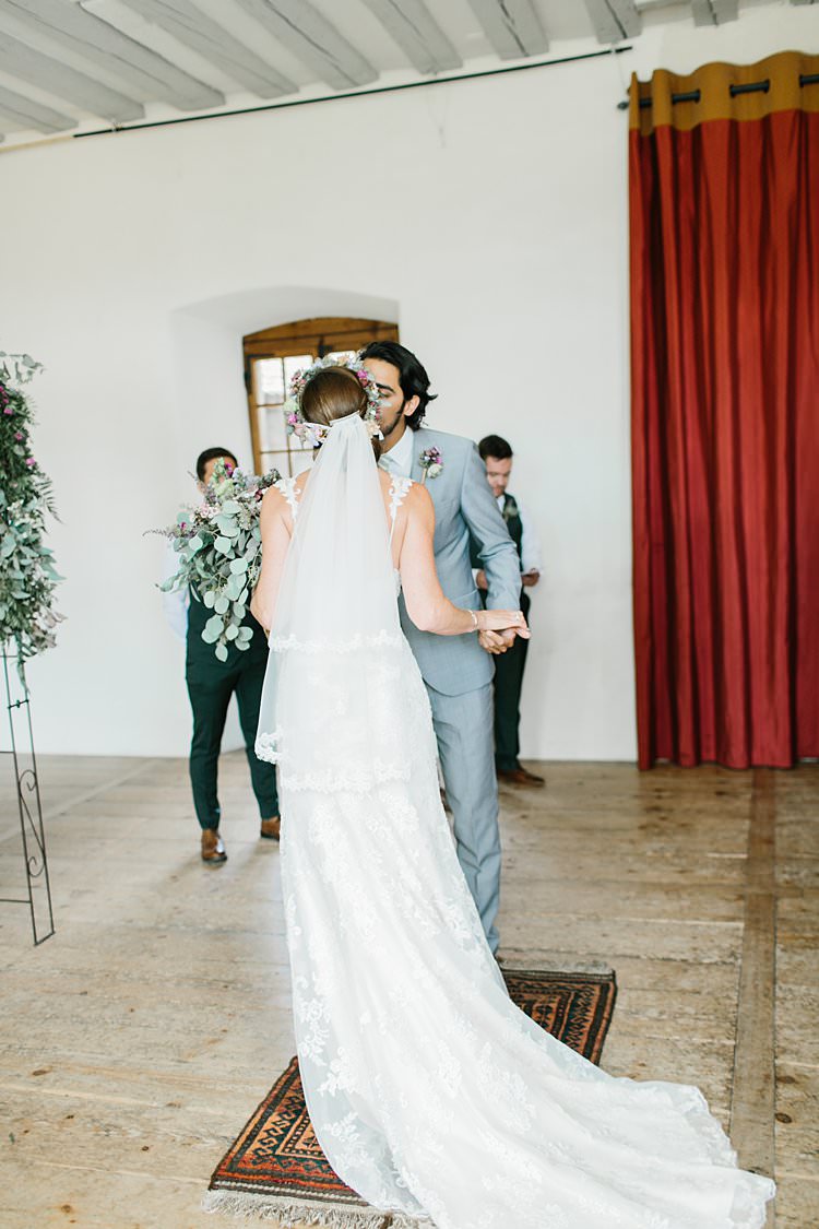 Destination Ceremony Bride Short Veil Groom Kiss Wild Natural Bouquet Rug | Romantic Castle Switzerland Wedding http://kbalzerphotography.com/