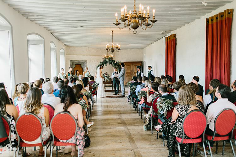 Destination Ceremony Bride Groom Aisle Wild Natural Bouquet Chandeliers Floral Arch | Romantic Castle Switzerland Wedding http://kbalzerphotography.com/