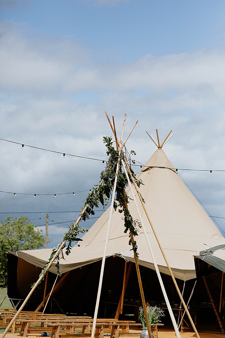 Tipi Ceremony Flower Greenery Backdrop Mega Laid Back Festival Party Wedding http://www.jessicawilliams.photography/