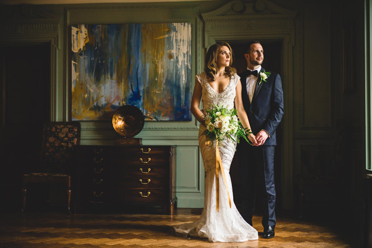 Bride Bridal Veil Dress Gown Embellished Fishtail Moss Bros Groom Navy Dinner Jacket Tuxedo Bow Tie Bouquet Ribbon Gold Sequins Marble Greenery Vintage Glamour Wedding https://www.tobiahtayo.com/