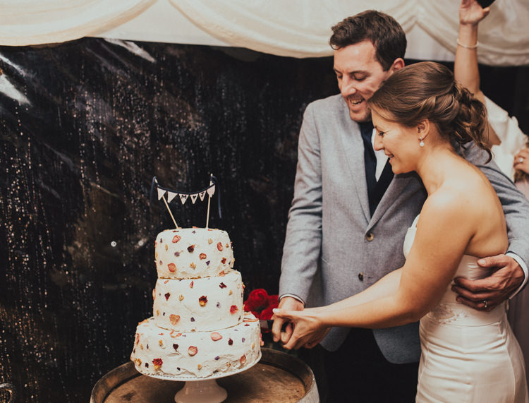 Cake Cutting Buttercream Meringue Petal Bride Bridal Dress Gown Suit Supply Groom Mismatched Grey Blue Jacket Three Piece Waistcoat Rustic Country Fun Autumn Farm Wedding http://natalyjphotography.com/