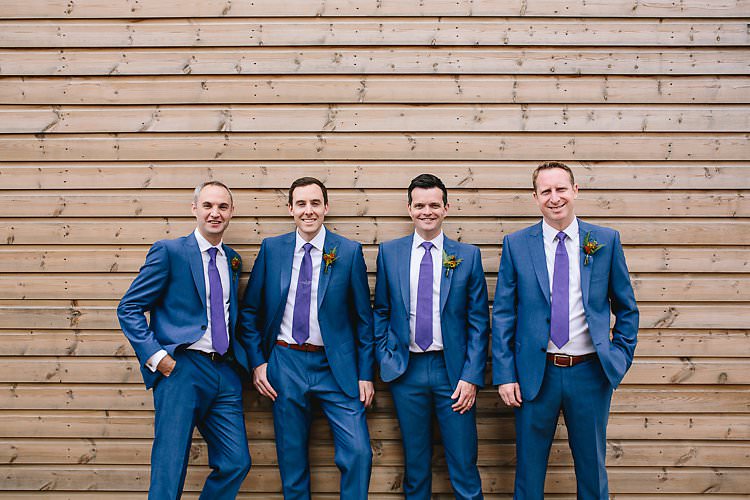 Blue Suits Purple Ties Groom Groomsmen Tropical Countryside Tipi Wedding https://parkershots.com/