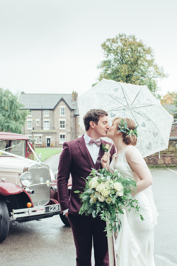 Bride Groom Kiss After Ceremony Under Umbrella Wild Foliage Bouquet | Greenery Burgundy City Autumn Wedding http://lisahowardphotography.co.uk/