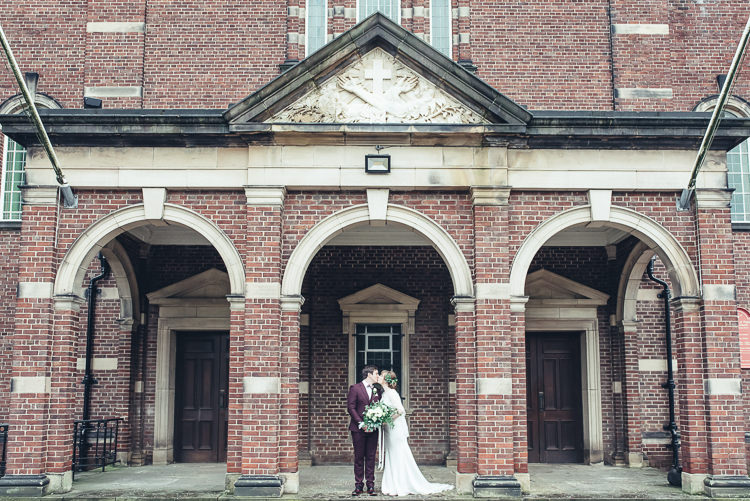 Bride Groom Kiss After Ceremony Romantic Industrial Brick Building Wild Foliage Bouquet | Greenery Burgundy City Autumn Wedding http://lisahowardphotography.co.uk/