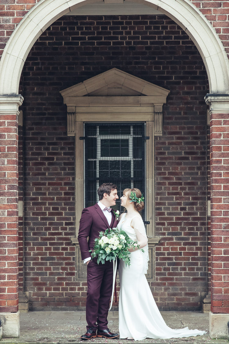 Bride Groom Kiss After Ceremony Romantic Brick Building Wild Foliage Bouquet | Greenery Burgundy City Autumn Wedding http://lisahowardphotography.co.uk/