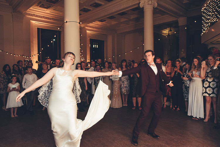 Bride Groom Funny First Dance Fast Twirl Fairy Lights Indoor Reception | Greenery Burgundy City Autumn Wedding http://lisahowardphotography.co.uk/
