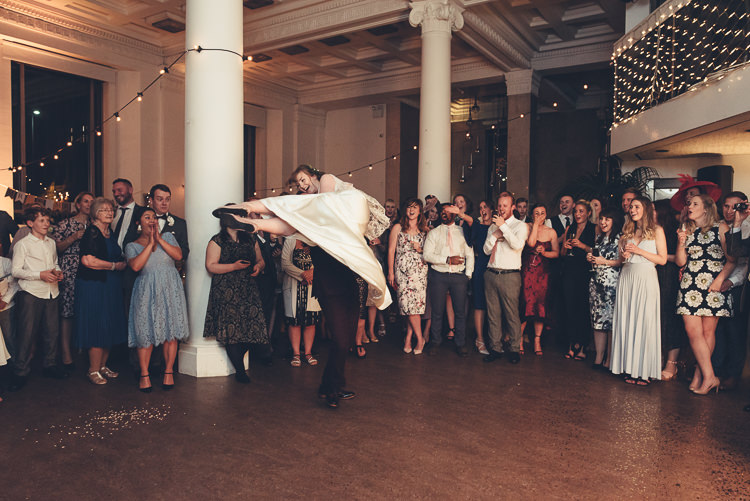 Bride Groom Funny First Dance Fast Twirl Lift Fairy Lights Indoor Reception | Greenery Burgundy City Autumn Wedding http://lisahowardphotography.co.uk/