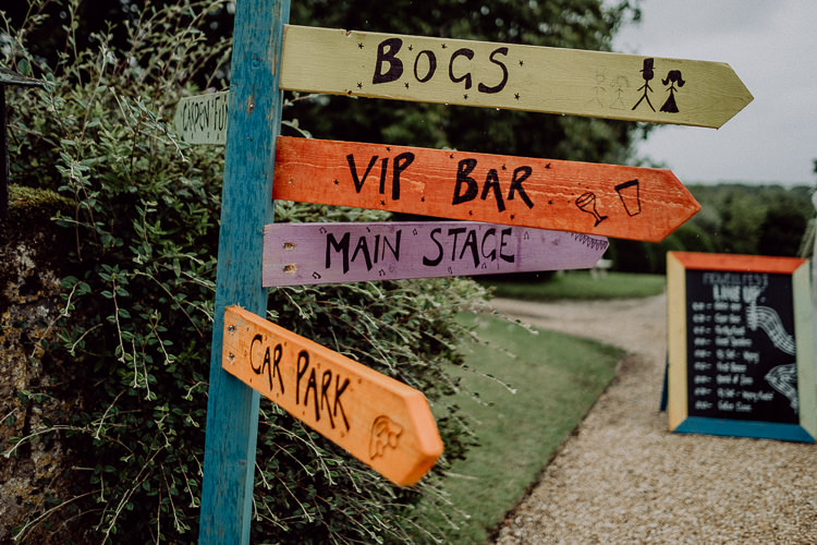 Painted Sign Post Stylish Rainy Festival Wedding http://albatrossandmariner.co.uk/