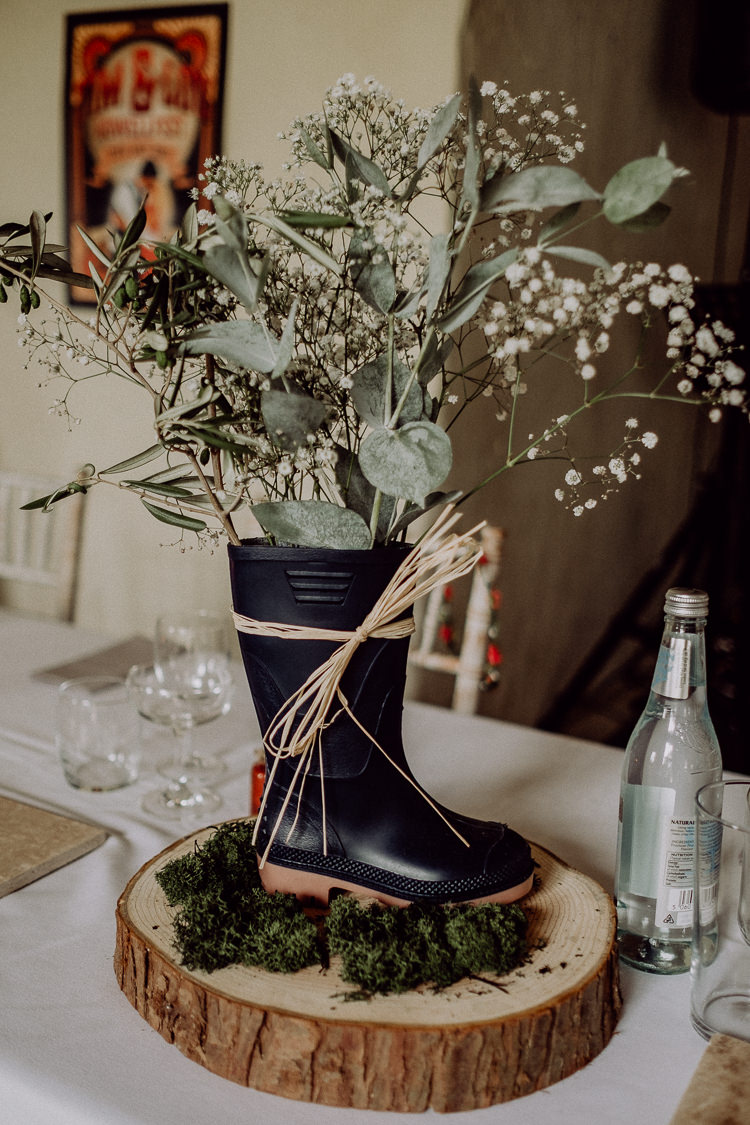 Welly Wellies Flowers Centrepiece Log Stylish Rainy Festival Wedding http://albatrossandmariner.co.uk/