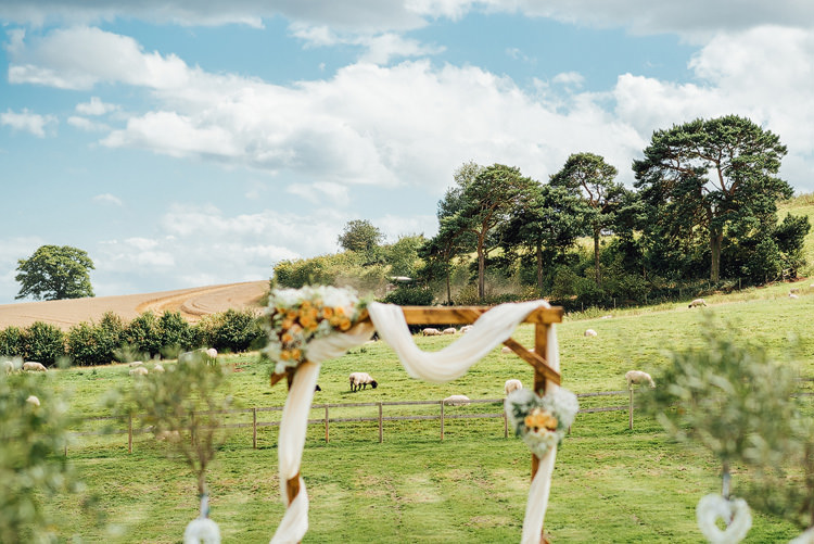 Ceremony Structure Wooden Floral Voile Backdrop Outdoor Summer Rustic Barn Wedding https://www.chebirchhayesphotography.com/
