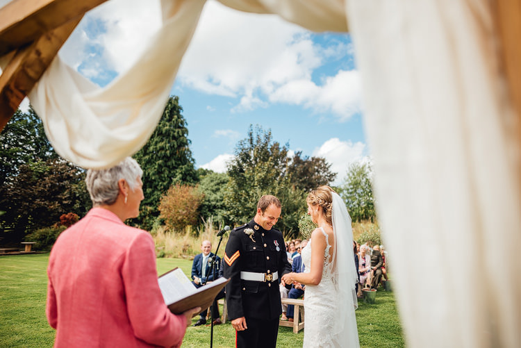 Ceremony Drapes Military Groom Bride Bridal Dress Gown Backless Veil Hairpiece Outdoor Summer Rustic Barn Wedding https://www.chebirchhayesphotography.com/