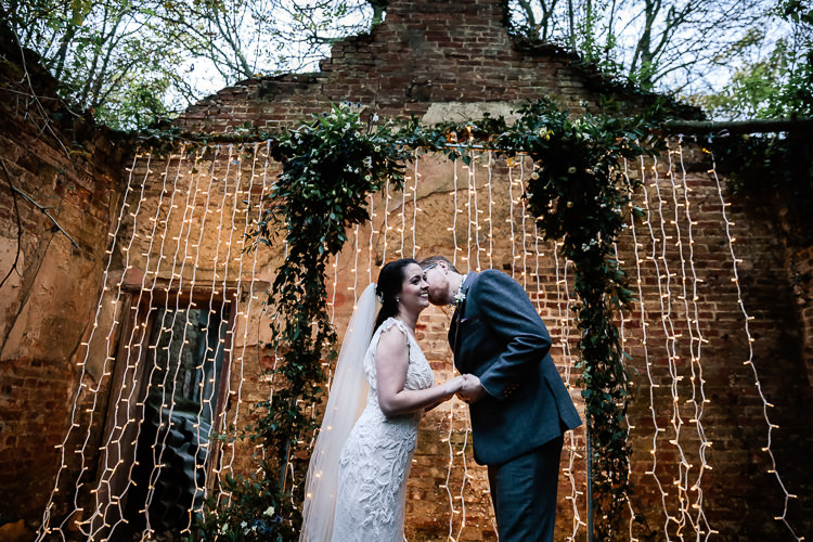 Backdrop Flowers Lighting Decor Arch Arbour Magical Fairy Lit Blue Gold Winter Wedding Ideas https://sarahbrookesphotography.com/