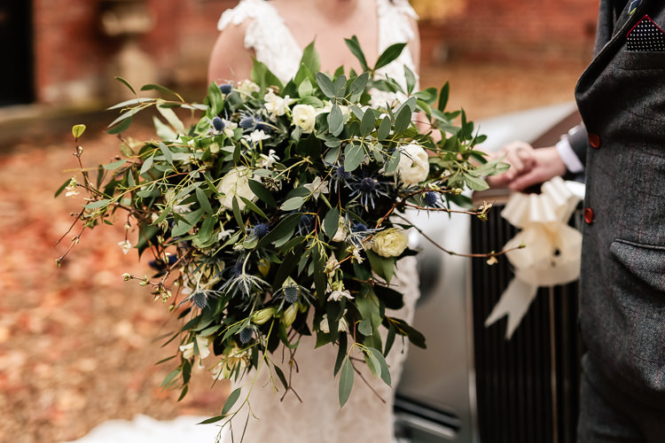 Bouquet Flowers Bride Bridal Greenery Thistle Ranunculus Magical Fairy Lit Blue Gold Winter Wedding Ideas https://sarahbrookesphotography.com/