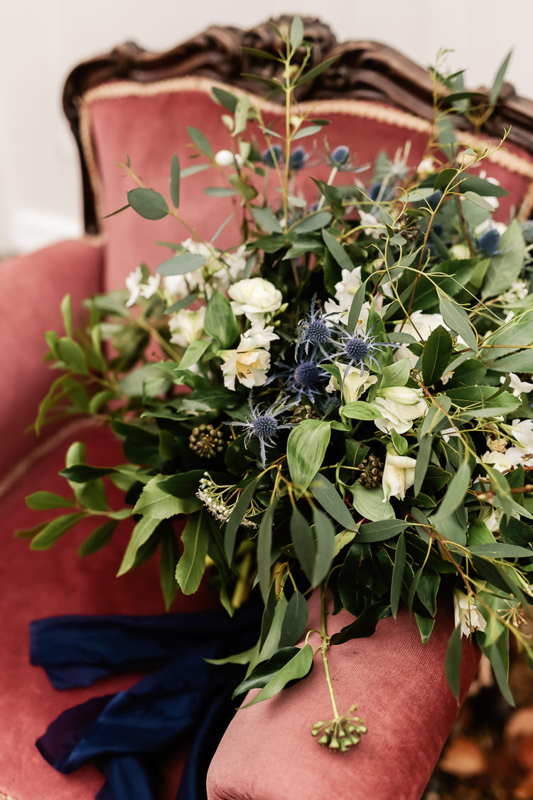 Bouquet Flowers Bride Bridal Greenery Thistle Ranunculus Magical Fairy Lit Blue Gold Winter Wedding Ideas https://sarahbrookesphotography.com/