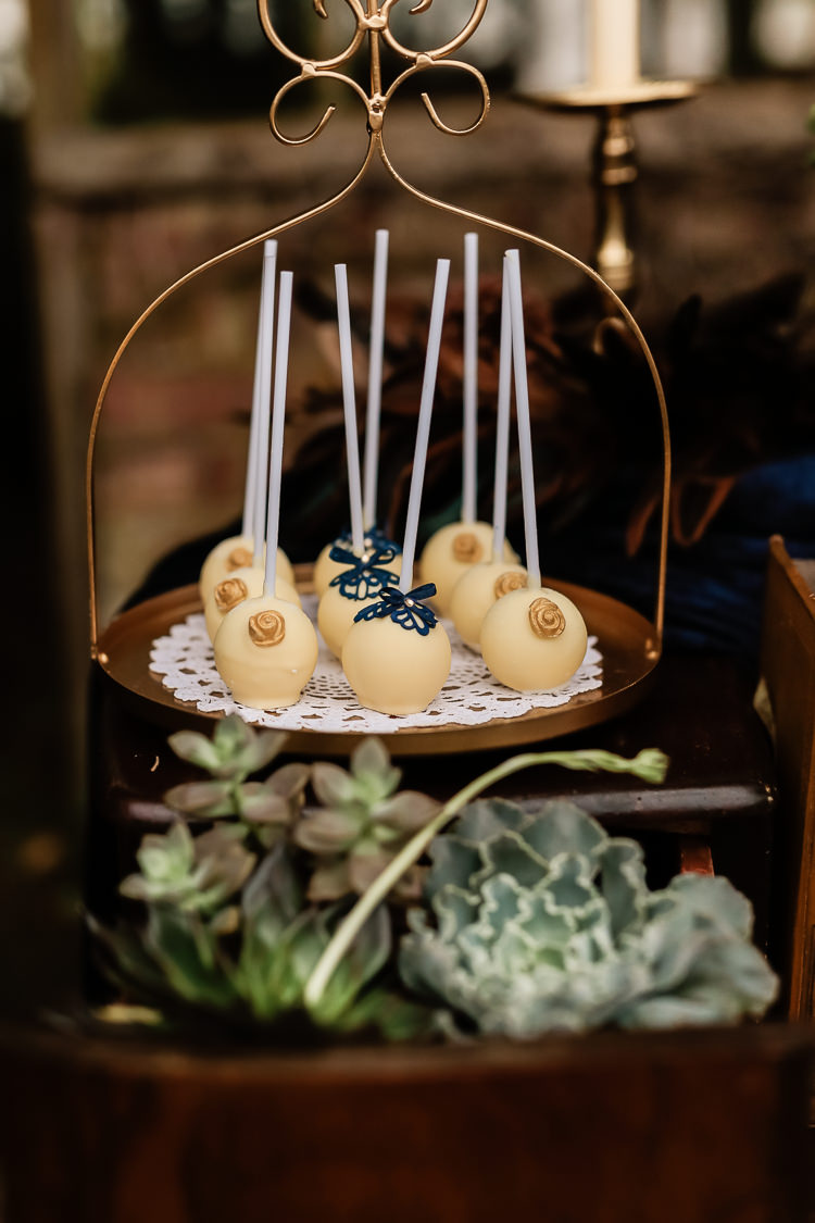 Cake Dessert Table Dresser Furniture Table Pops Magical Fairy Lit Blue Gold Winter Wedding Ideas https://sarahbrookesphotography.com/