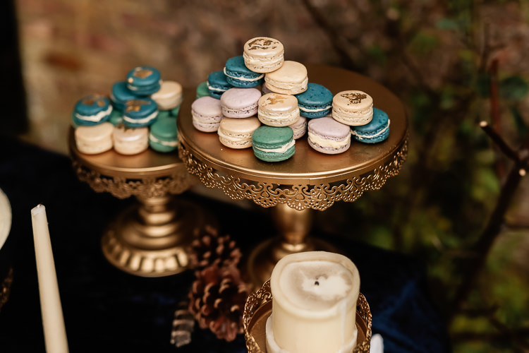 Cake Dessert Table Dresser Furniture Table Macarons Magical Fairy Lit Blue Gold Winter Wedding Ideas https://sarahbrookesphotography.com/