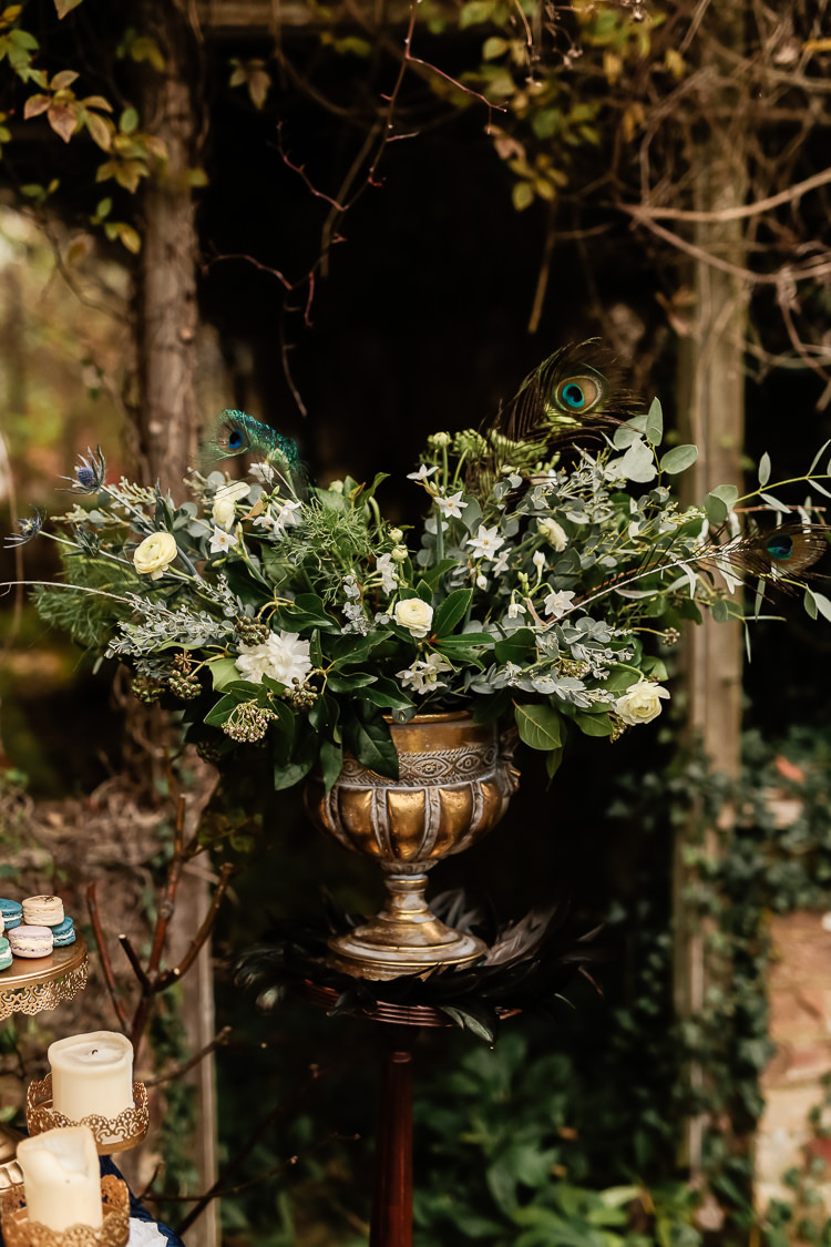 Flowers Peacock Feathers Greenery Thistle Ranunculus Magical Fairy Lit Blue Gold Winter Wedding Ideas https://sarahbrookesphotography.com/