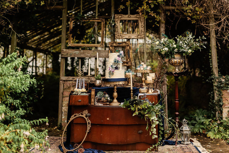 Cake Dessert Table Dresser Furniture Table Magical Fairy Lit Blue Gold Winter Wedding Ideas https://sarahbrookesphotography.com/