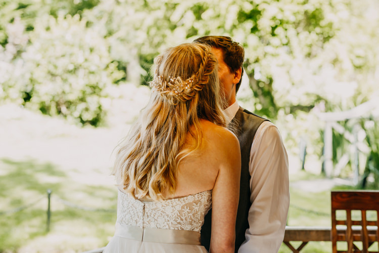 Bride Groom Kiss Braids Long Medium Hair Down Informal | Rustic Relaxed Cornflower Blue Barn Wedding http://www.peterhugophotography.com/