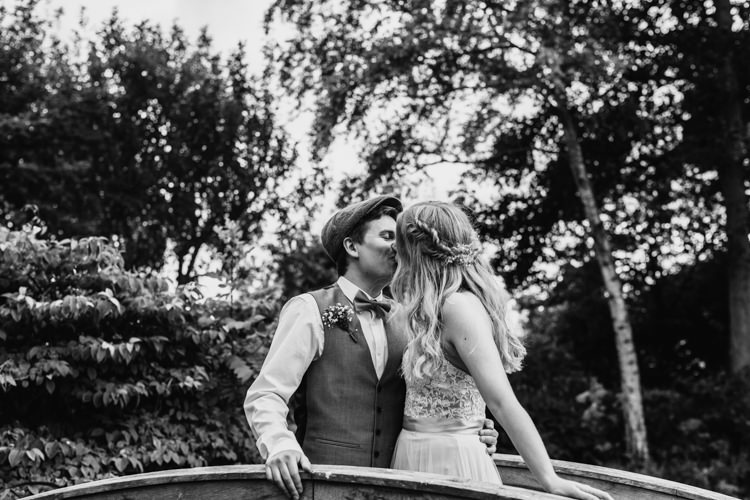 Bride Groom South Farm Bridge Black and White Kiss Photo | Rustic Relaxed Cornflower Blue Barn Wedding http://www.peterhugophotography.com/