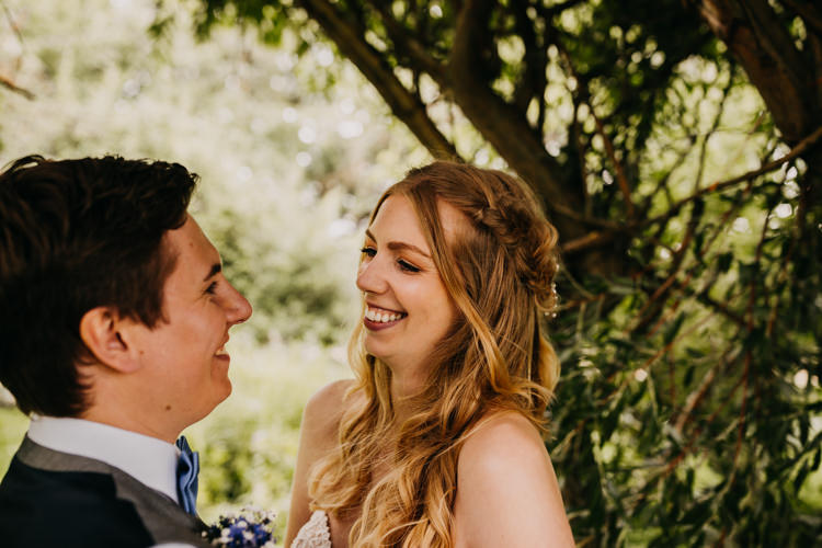 Intimate Bride Groom Outdoors Field Woodland Laughing | Rustic Relaxed Cornflower Blue Barn Wedding http://www.peterhugophotography.com/