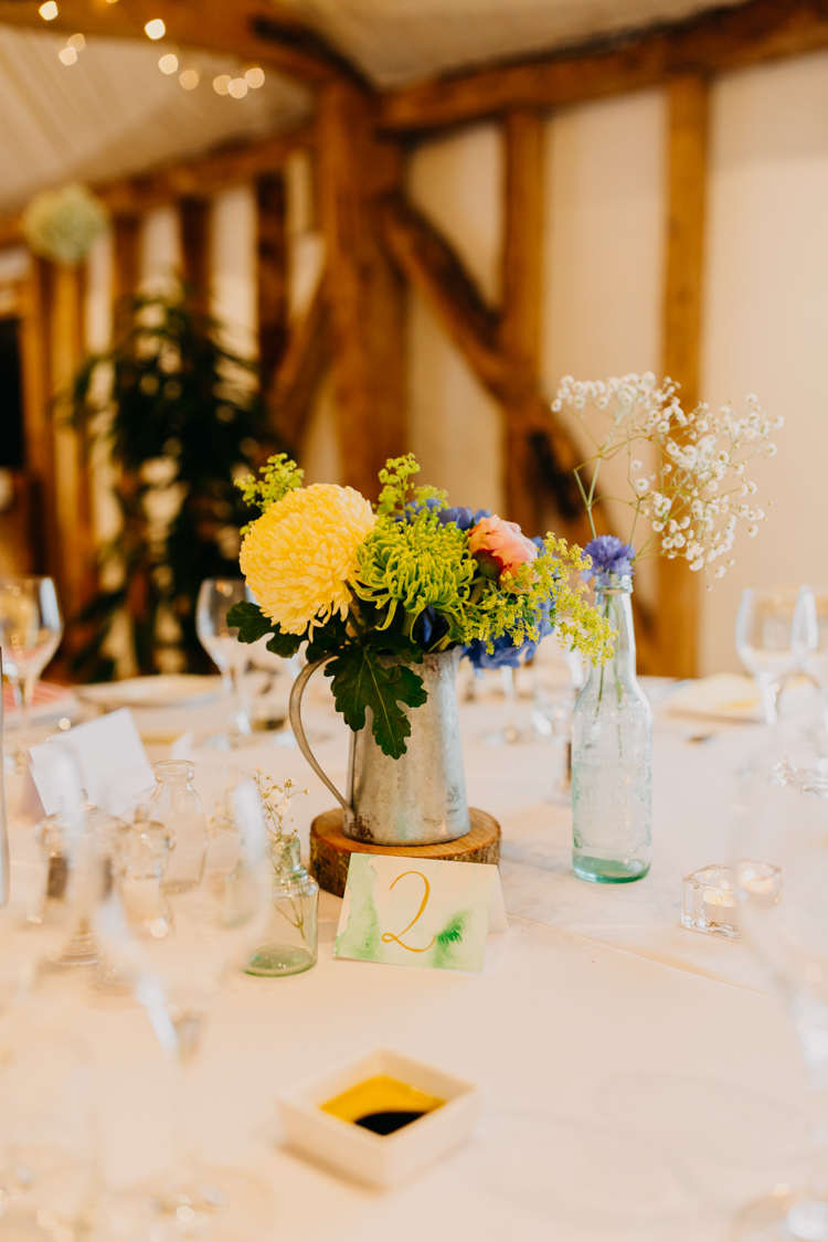 DIY Watercolor Table Numbers Yellow Blue Pink Centrepieces | Rustic Relaxed Cornflower Blue Barn Wedding http://www.peterhugophotography.com/