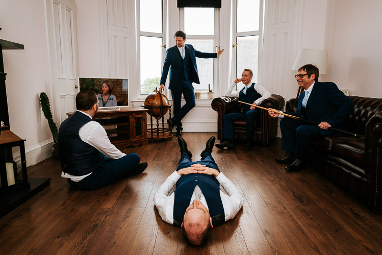 Groom Groomsmen Waiting Funny Navy Suits | Glitter Dinosaurs City Wedding https://struvephotography.co.uk/