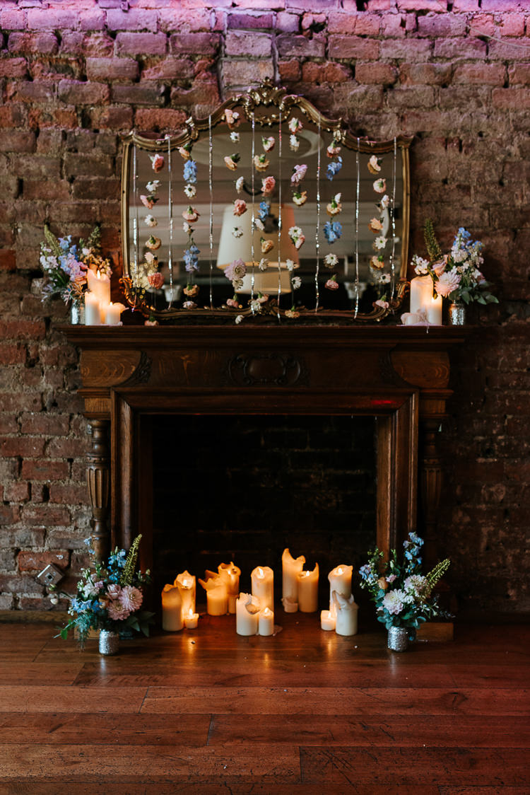 Hanging Floral Curtain Mantlepiece Installation Candles Flowers | Glitter Dinosaurs City Wedding https://struvephotography.co.uk/