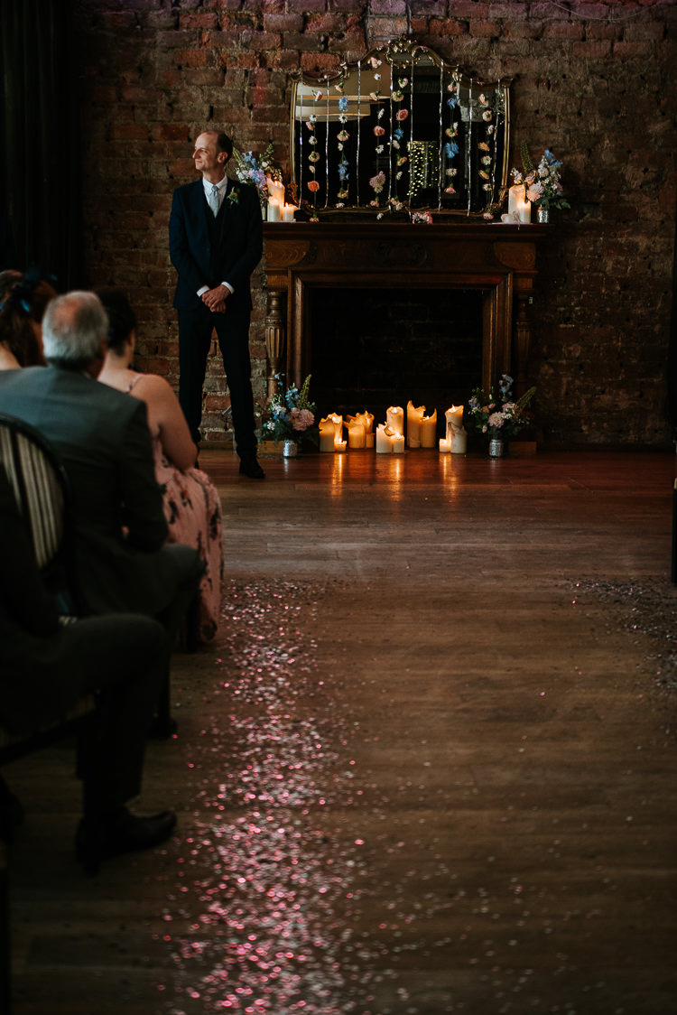 Hanging Flower Curtain Ceremony Backdrop Aisle Glitter Groom | Glitter Dinosaurs City Wedding https://struvephotography.co.uk/