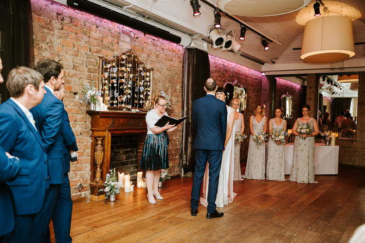 Urban Decor Ceremony Hanging Floral Curtain Bride Groom Celebrant | Glitter Dinosaurs City Wedding https://struvephotography.co.uk/
