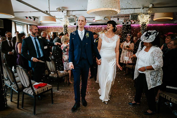 Bride Groom Glitter Sparkling Confetti Ceremony Aisle | Glitter Dinosaurs City Wedding https://struvephotography.co.uk/