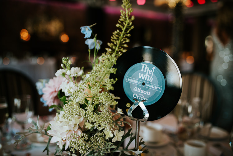 Music Record Table Name Vinyl Decor Blush Pastel Flower Centrepiece | Glitter Dinosaurs City Wedding https://struvephotography.co.uk/