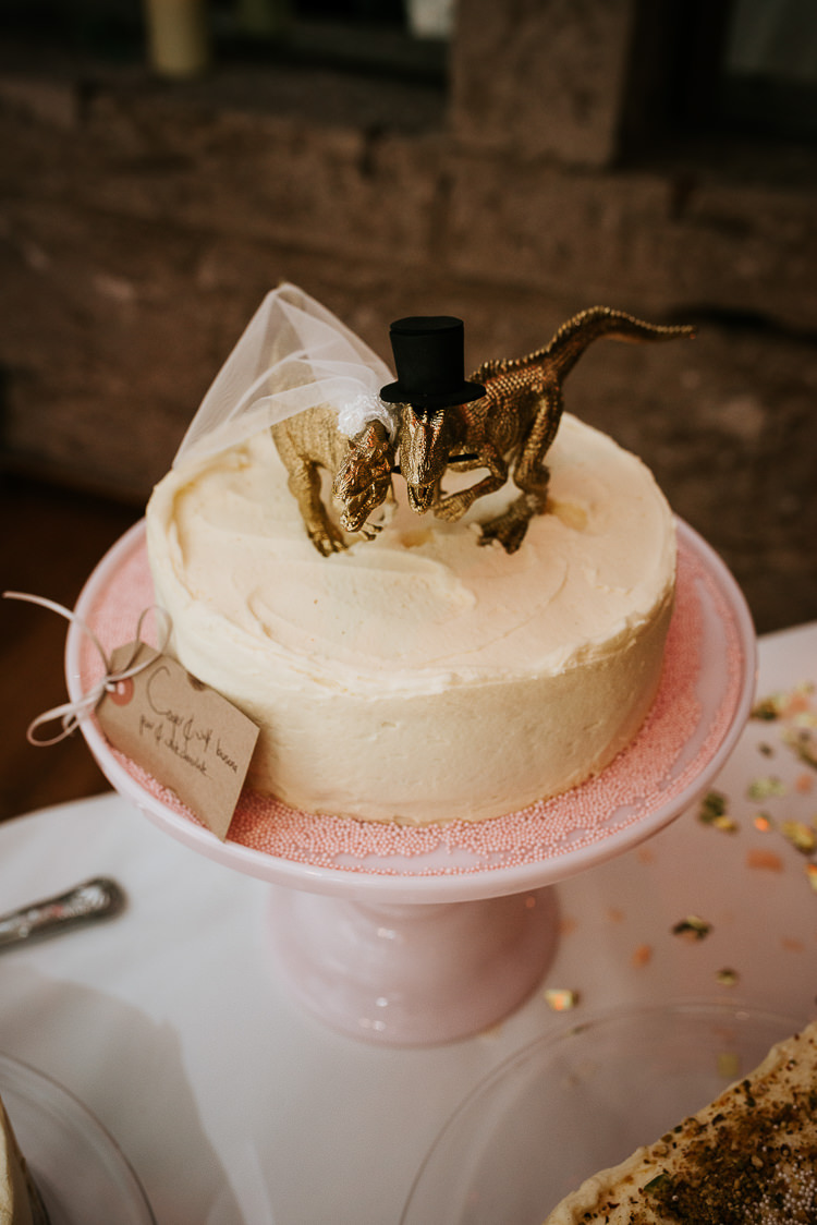 Gold Dinosaur Cake Topper Alternative Theme Quirky | Glitter Dinosaurs City Wedding https://struvephotography.co.uk/
