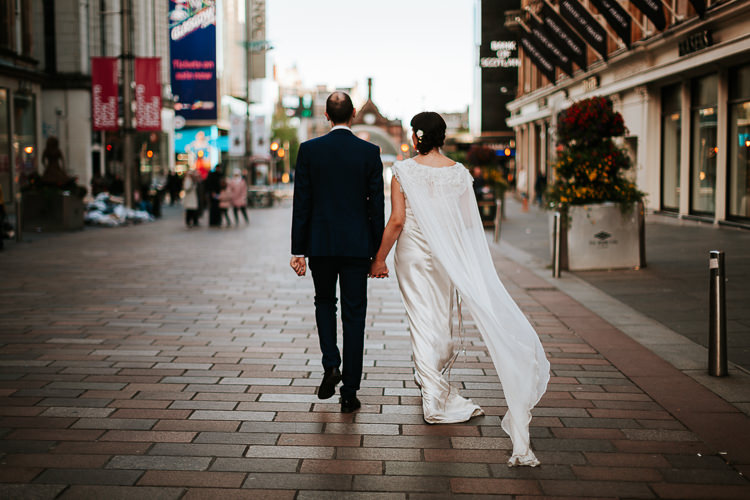 Bride Groom Walk City Street Photography Glasgow Scotland Cape Dress | Glitter Dinosaurs City Wedding https://struvephotography.co.uk/