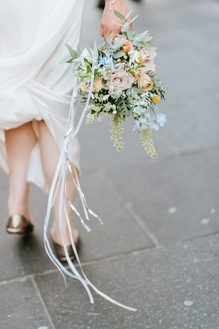 Bride Gold Flat Shoes Pastel Wildflower Bouquet City Urban Quirky | Glitter Dinosaurs City Wedding https://struvephotography.co.uk/