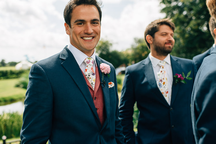 Red Waistcoat Groom Floral Tie Blue Suit Festival Bohemian Glamping Wedding https://theshannons.photography/