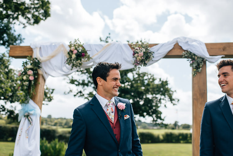 Red Waistcoat Groom Floral Tie Blue Suit Festival Bohemian Glamping Wedding https://theshannons.photography/