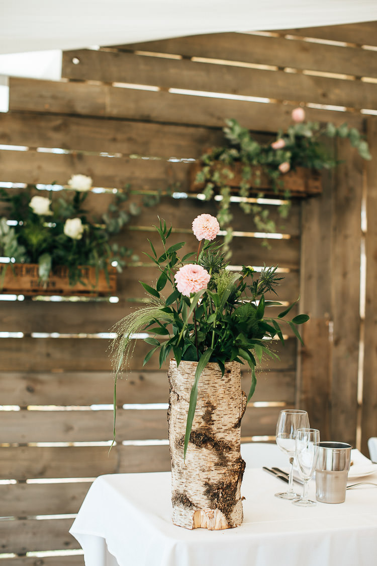 Log Bark Flowers Decor Tables Festival Bohemian Glamping Wedding https://theshannons.photography/