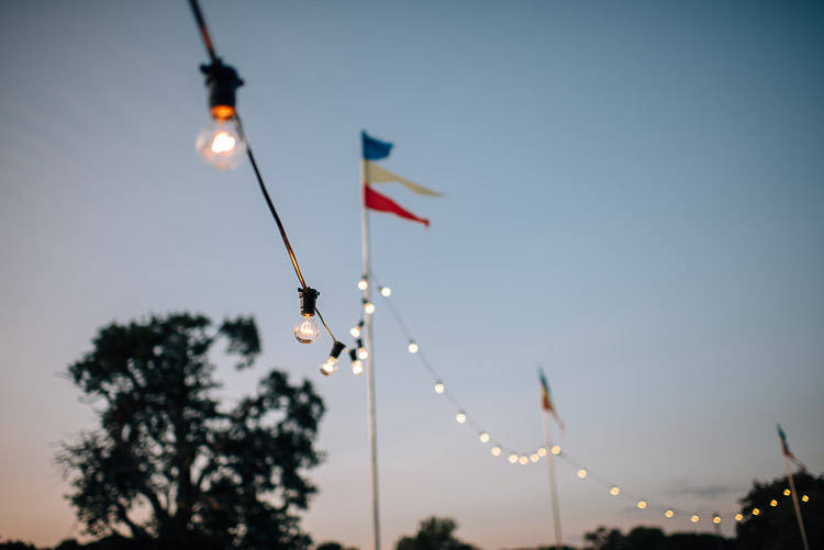 Festoon Lights Flags Festival Bohemian Glamping Wedding https://theshannons.photography/