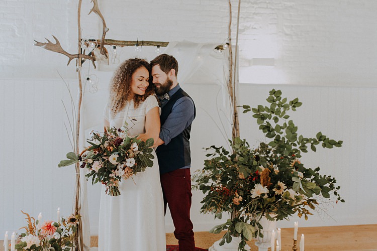 Branch Antler Wooden Arch Backdrop Flowers Arbour Ceremony Banquets Bonfires Autumn Wedding Ideas https://lolarosephotography.com/