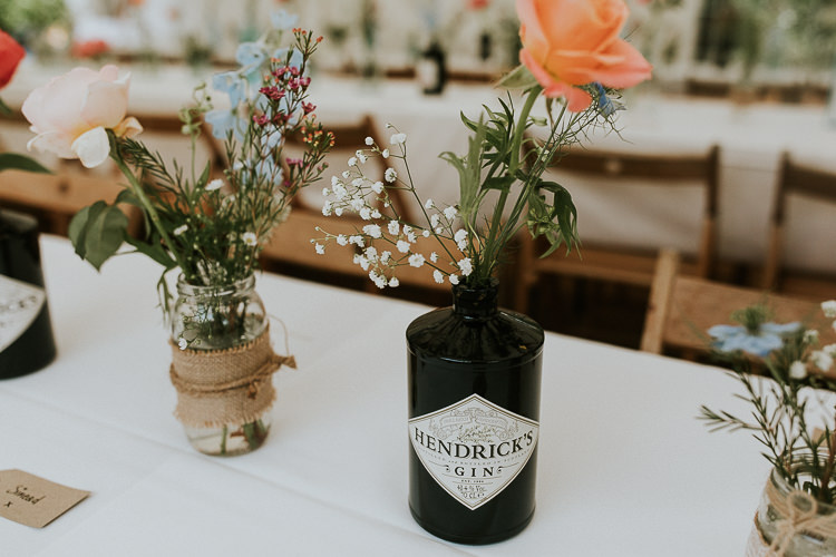 Gin Bottle Flowers Bright Colourful DIY Back Garden Wedding http://jonnymp.com/