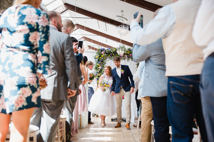 Bride Bridal Tea Length High Neck Lace Bespoke Dress Gown Wildflower Bouquet Groom Cream Chinos Navy Jacket Bow Tie Relaxed Fun Beach DIY Wedding http://www.michellehuggleston.com/